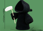 Black hand held sickle death god